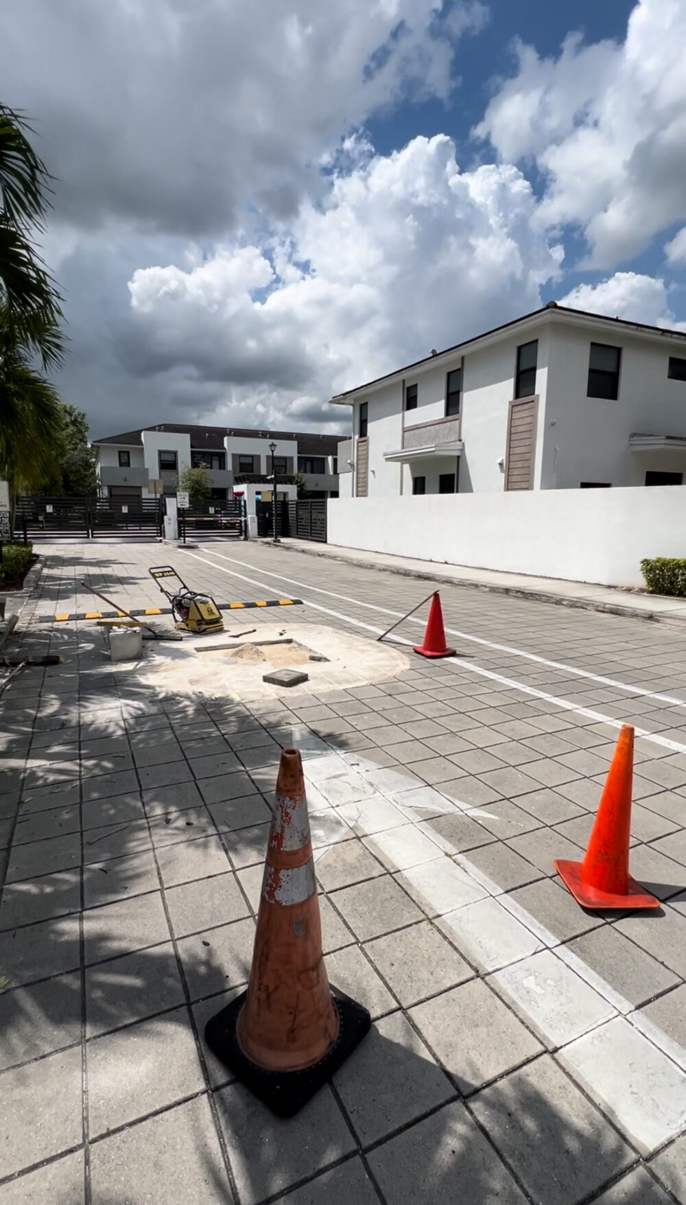 Community pavers and speed bump repair in progress at a gated property