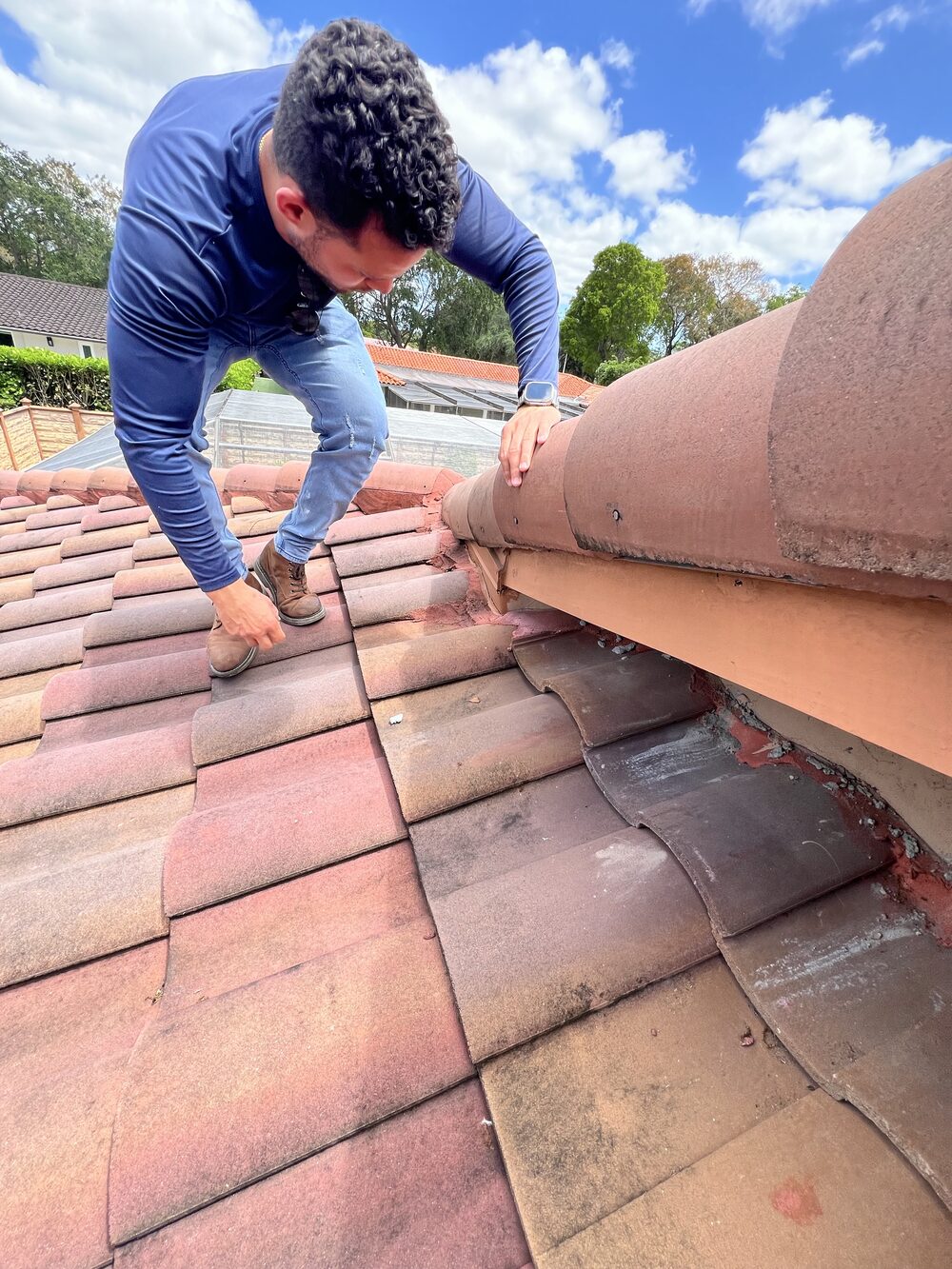 Roof inspection on a tile roof at a managed property